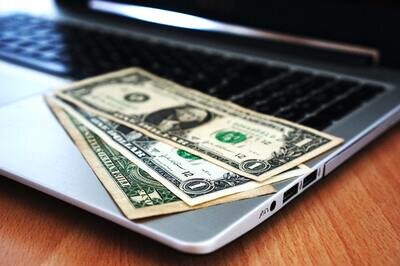 ERP budget - computer with dollar bills